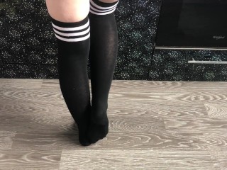 teen girl show her college knee high black socks