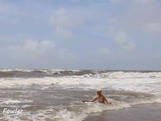 SPY LOOKING AS A BLONDE BEAUTIFUL BABE SWIMMING TOPLEES IN THE HIGH WAVES ON THE PUBLIC BEACH
